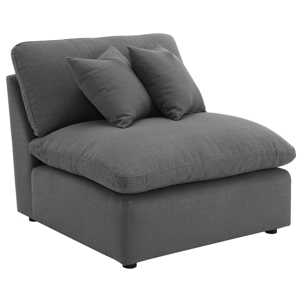Charcoal upholstered sofa chaise with three seat/back pillows and rounded arms
