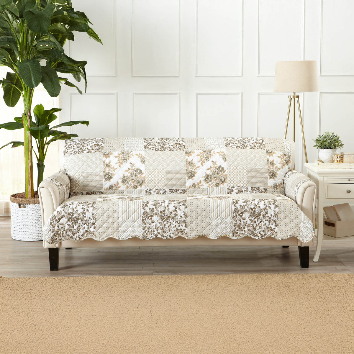 Reversible loveseat protector on loveseat, patchwork taupe floral and geometric quilt design