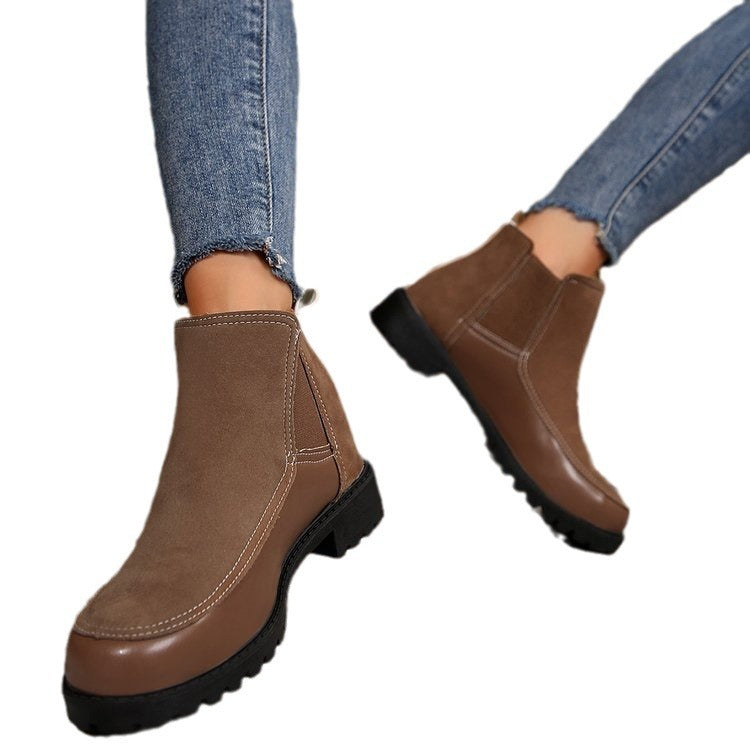 Tan platform ankle boots, pull-on style with side stitching and thick tread sole
