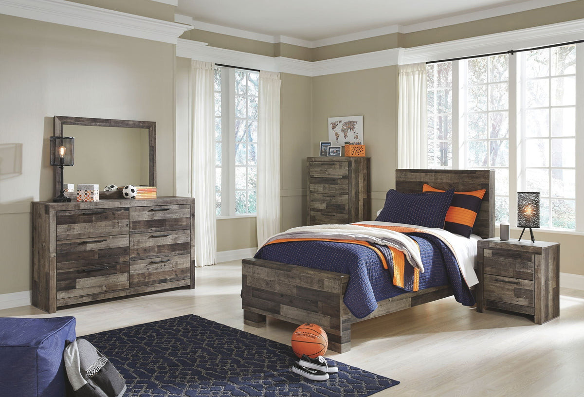 Youth panel bedroom set with gray bed, dresser with mirror, and two nightstands