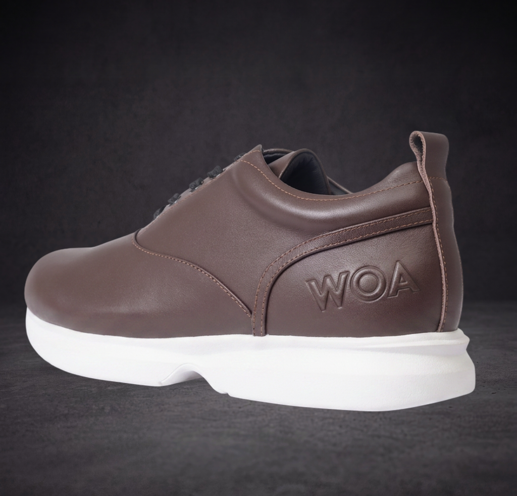 WOA brown low-top sneaker heel and side view with logo patch and white sole