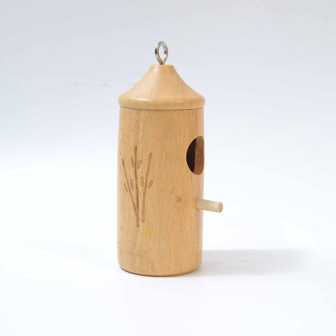 Wooden hanging birdhouse ornament with domed top, round entrance hole, and side perch stick.