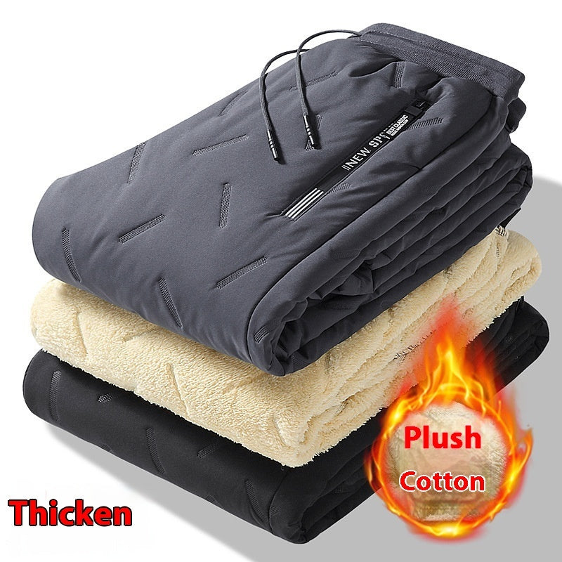 Folded gray and black fleece sweatpants with sherpa lining and drawstring waist