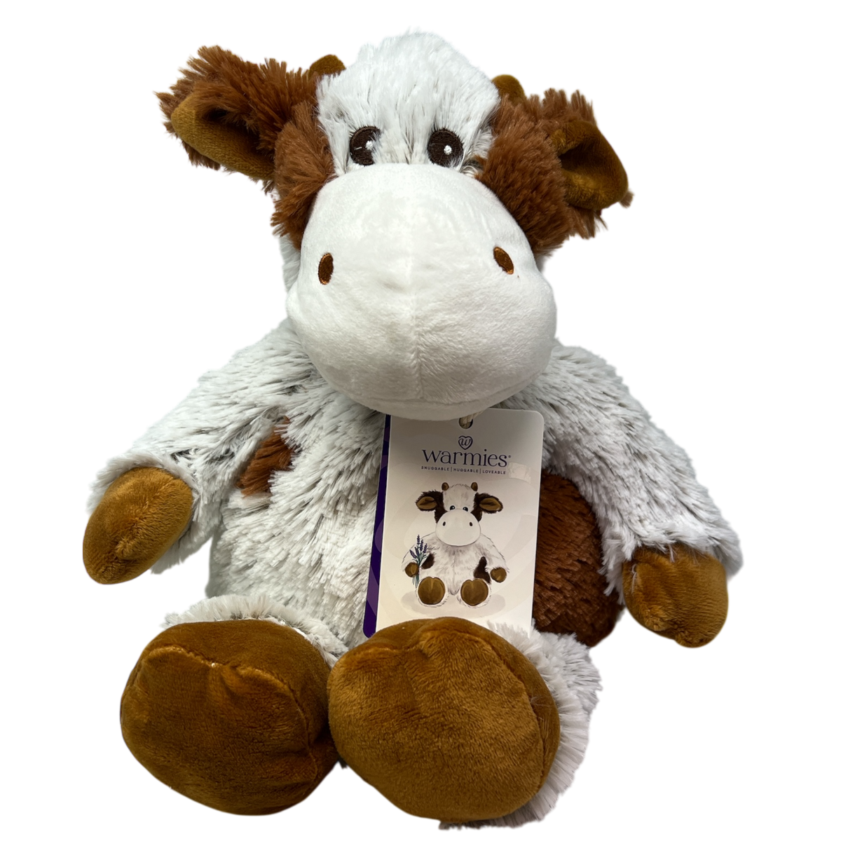 Stuffed cow plush toy in white and brown with Warmies label on chest