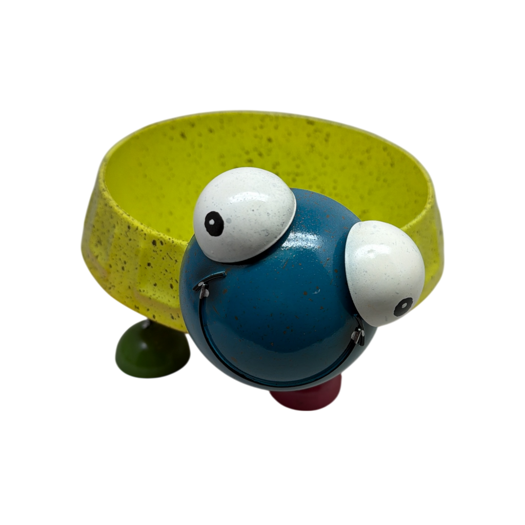 Turtle planter stand with yellow bowl base, blue body, white eyes, and curved legs