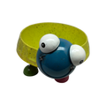 Turtle planter stand with yellow bowl base, blue body, white eyes, and curved legs