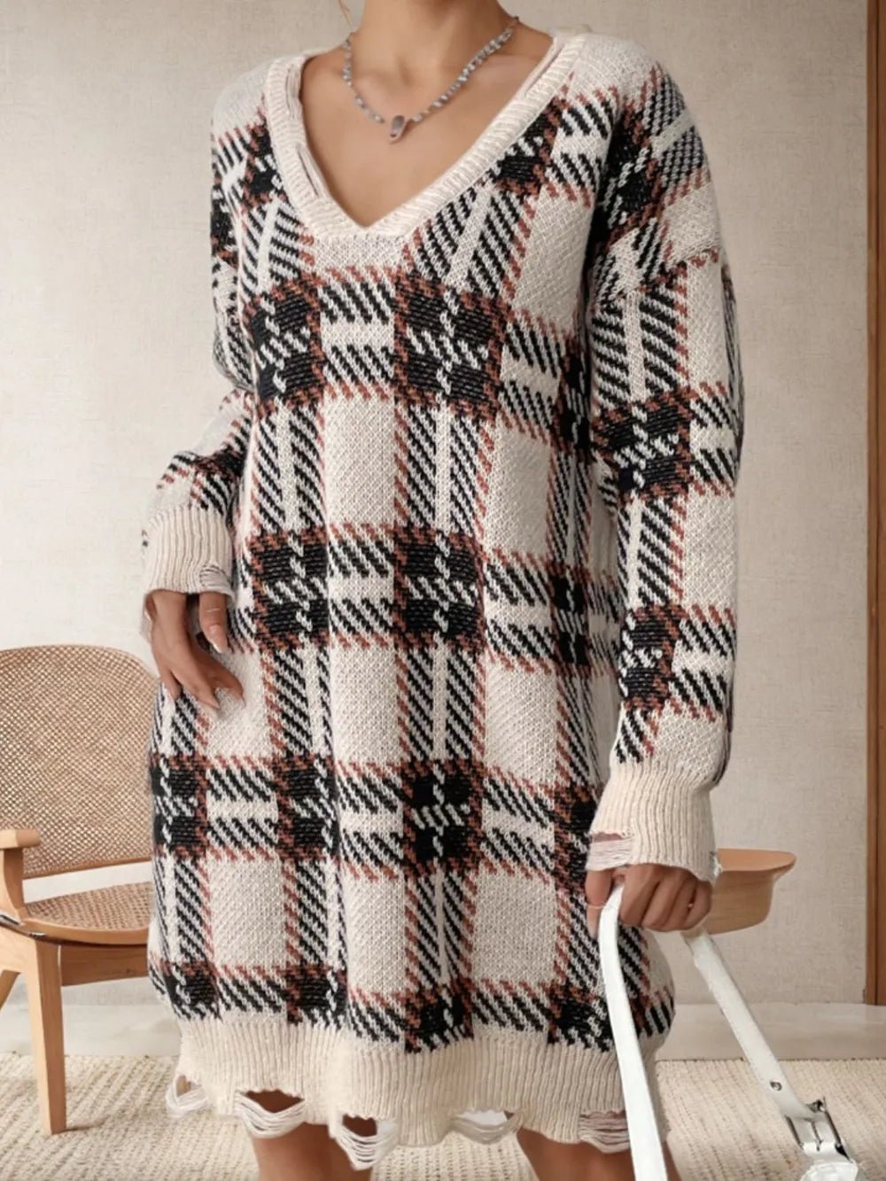 Distressed plaid V-neck sweater dress with long sleeves, cream with black check pattern