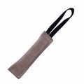 Beige leather training bite tug pillow with black carrying handle strap