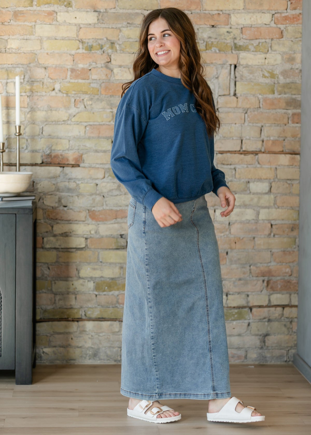 Light-wash denim maxi skirt with five-pocket styling and straight silhouette