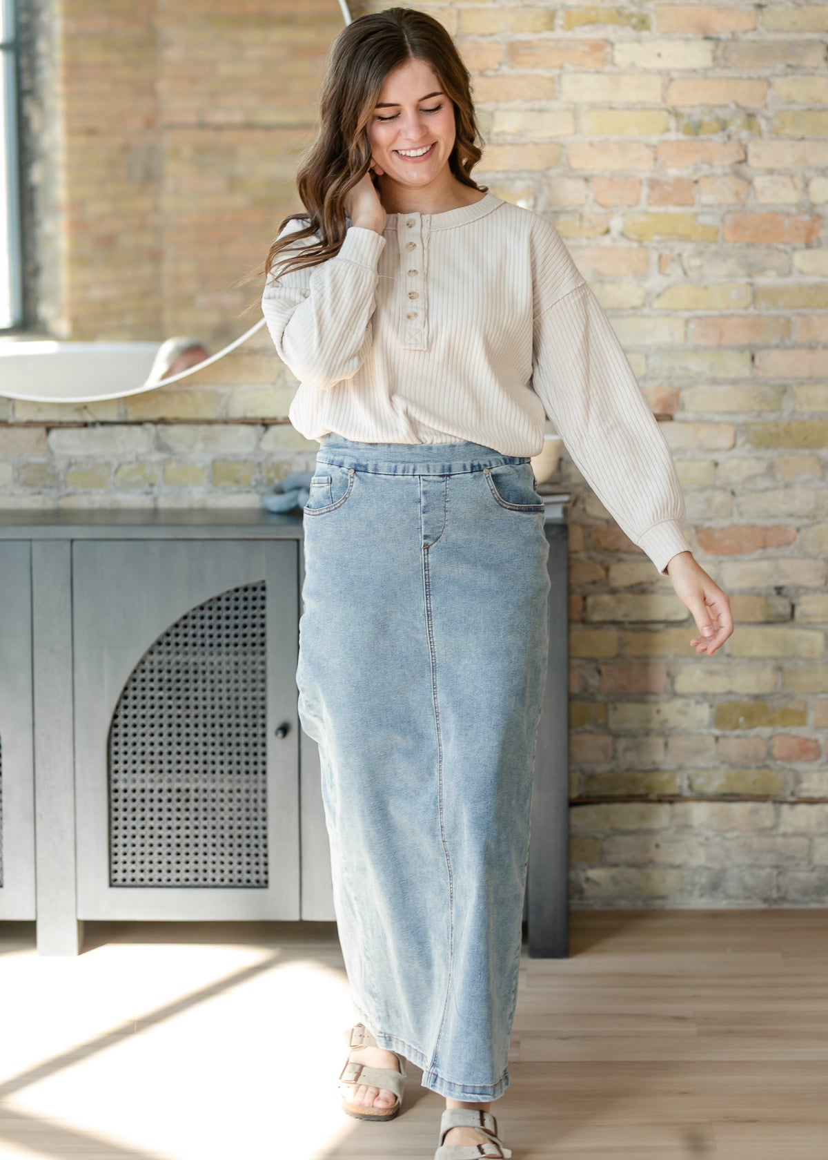 Light-wash maxi denim skirt with front pockets and back yoke seam detail