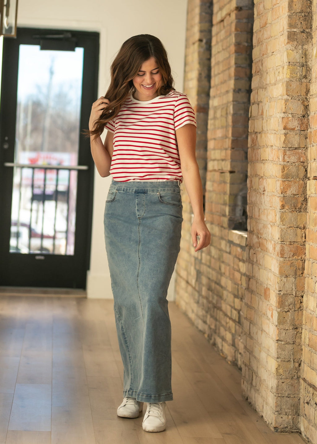 Blue-wash maxi denim skirt with front pockets and high-waist fit