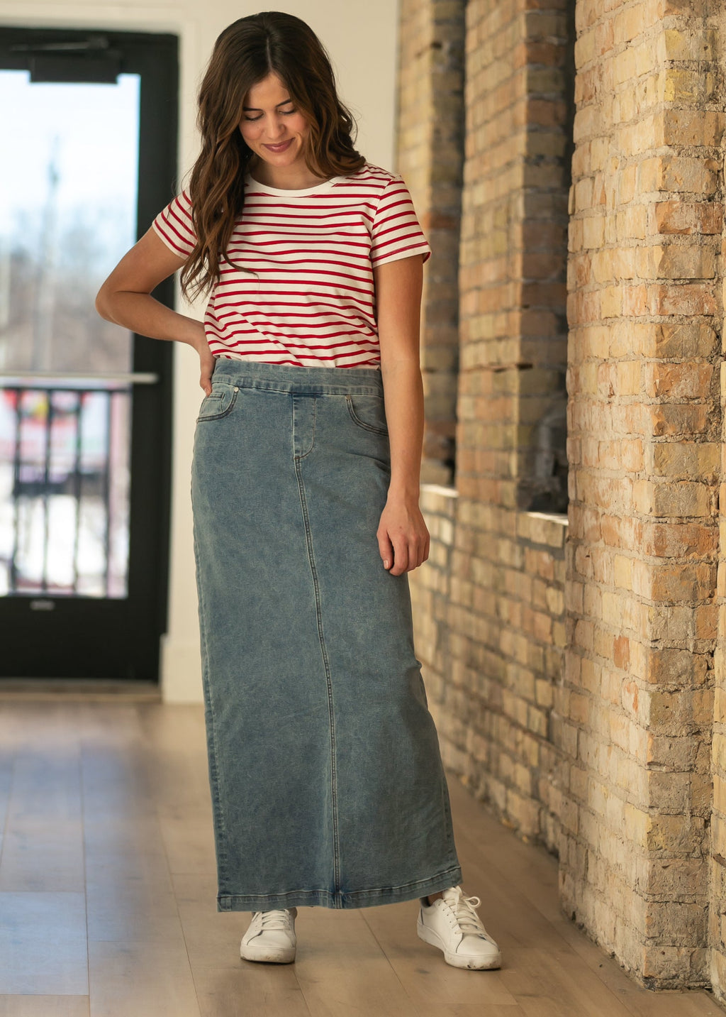 Light wash maxi denim skirt with belt loops and front seam