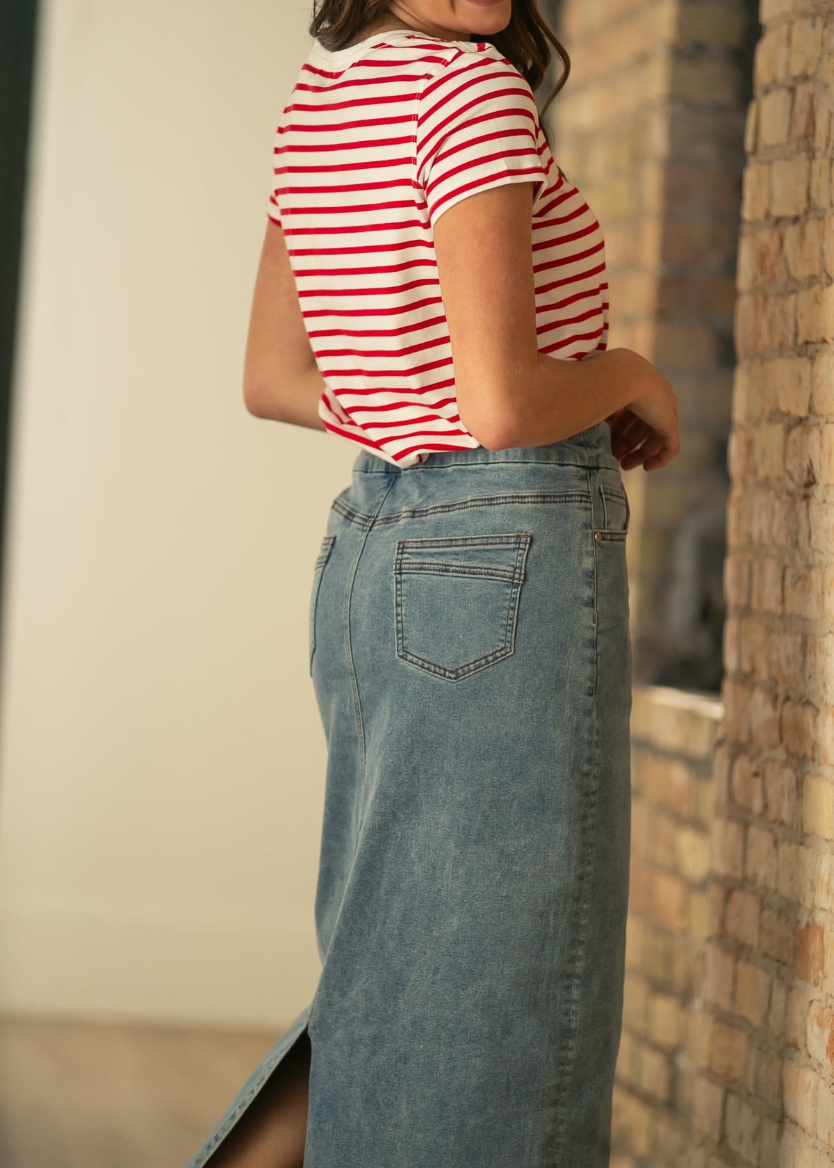 Light-wash maxi denim skirt with patch pockets and long straight cut