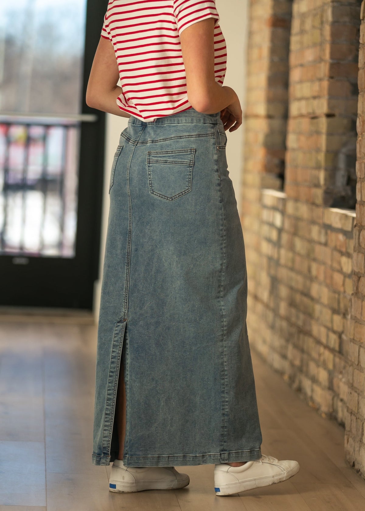 Blue denim maxi skirt with center seam and split hem detail