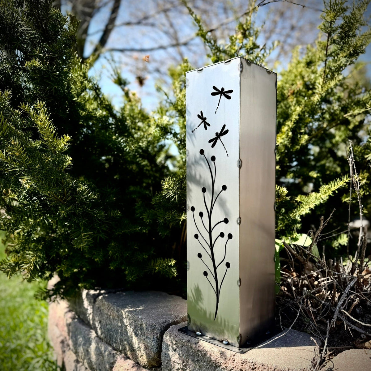 Steel solar luminary pillar with black dragonfly and branch cutout design