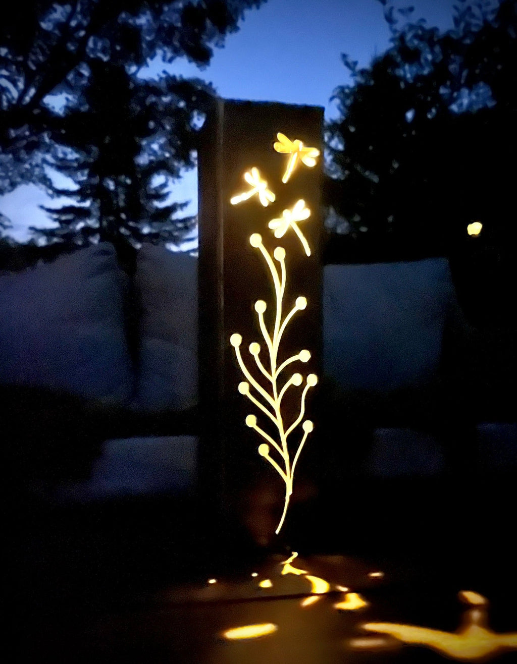 Steel solar luminary pillar with bright golden dragonfly branch lights