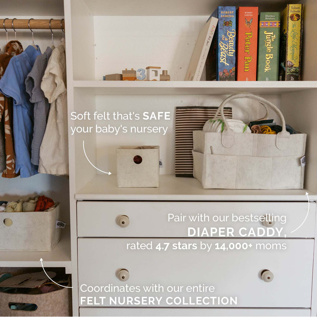 Light beige felt drawer organizer bins with round cutout handles in nursery storage