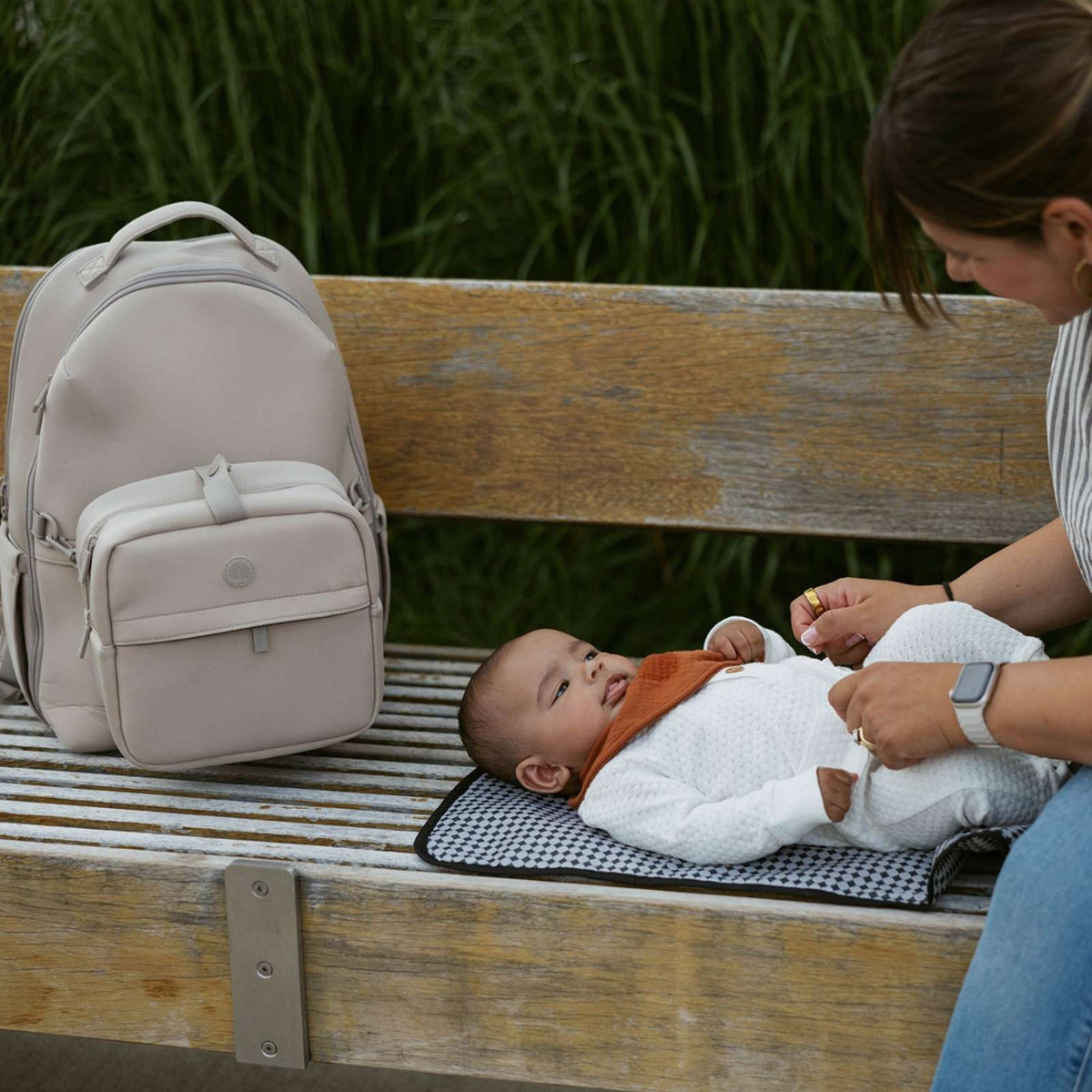 Neoprene diaper backpack in light gray, open front pocket and padded changing mat