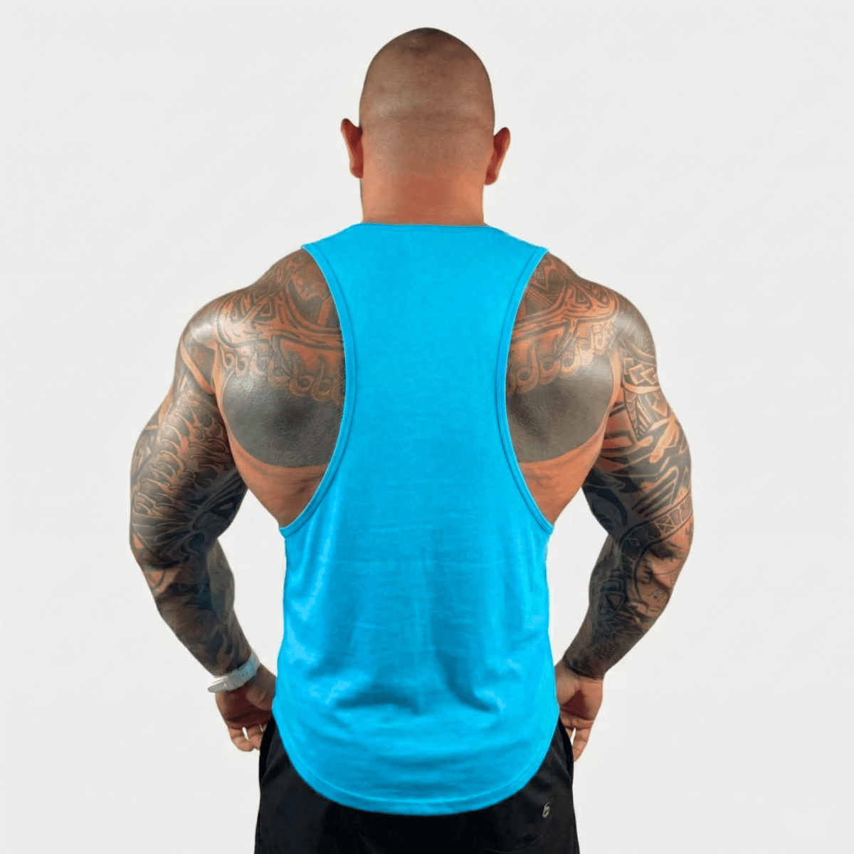 Light blue drop arm tank top back view with racerback scoop