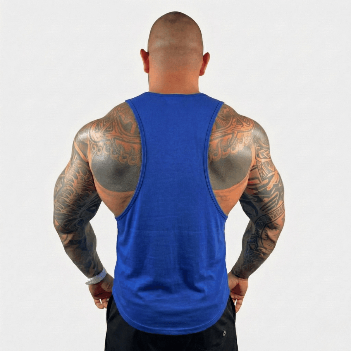 Blue drop arm tank top with scoop back and sleeveless racer cut