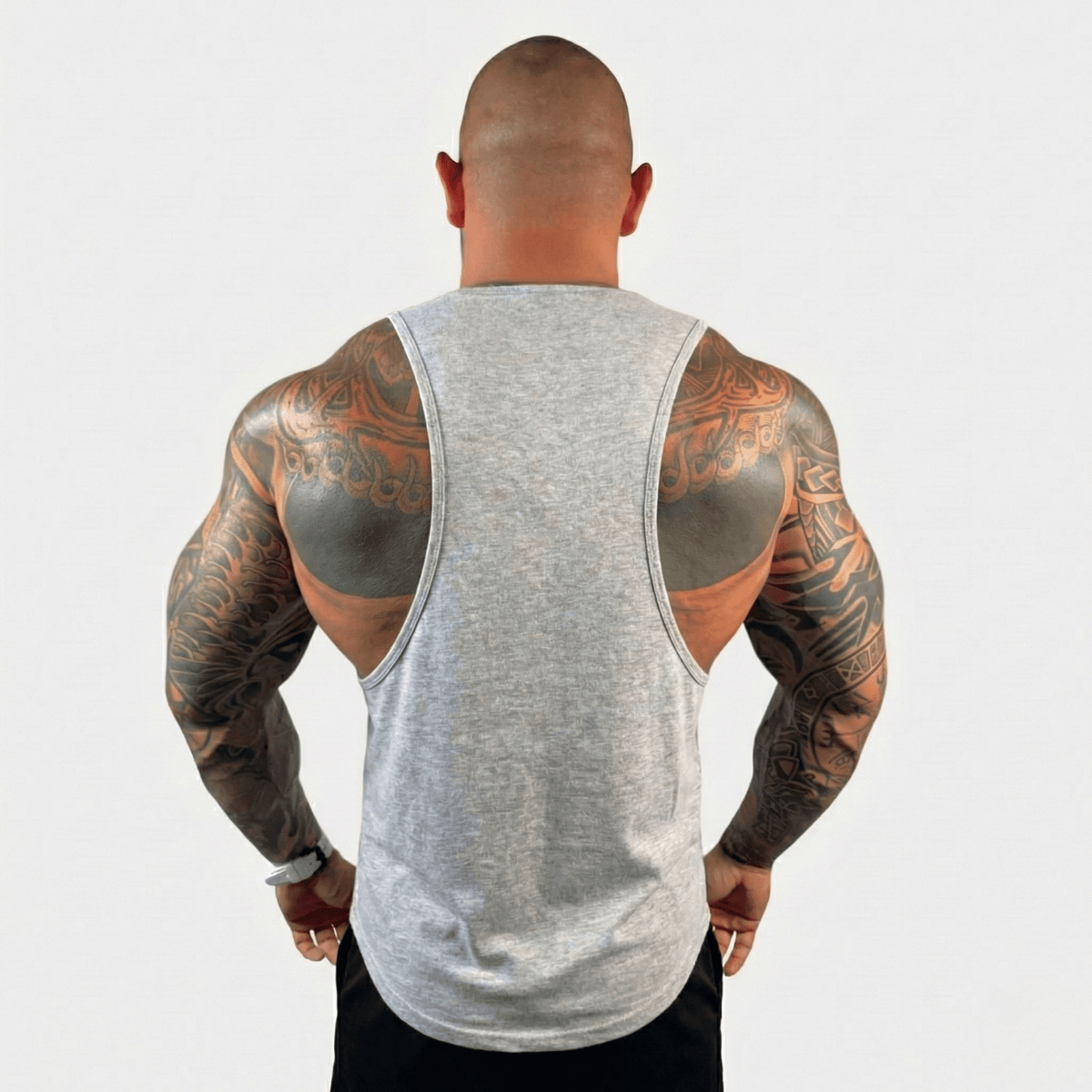 Men's drop arm tank top in heather gray, back view with wide armholes