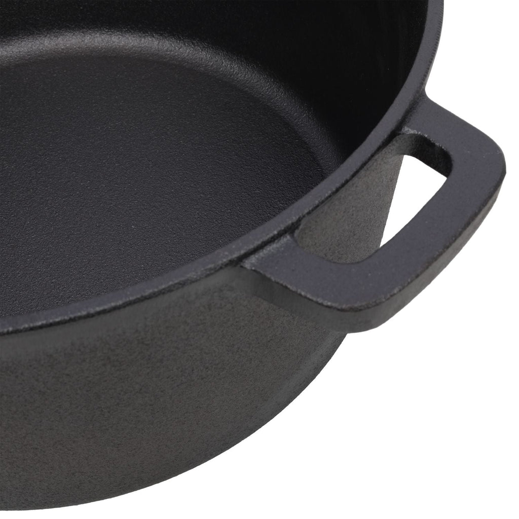Close-up of black cast iron Dutch oven side handle attachment