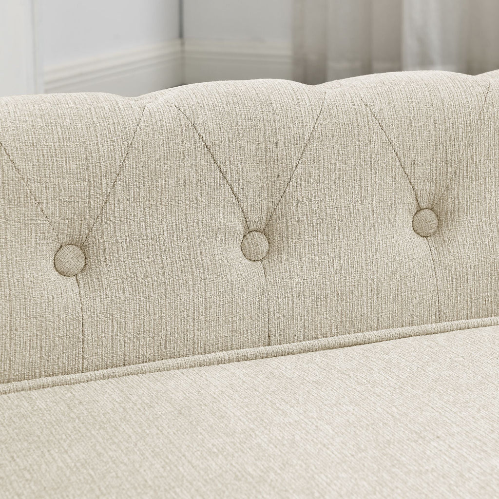 Beige dog sofa bed backrest with evenly spaced button tufting