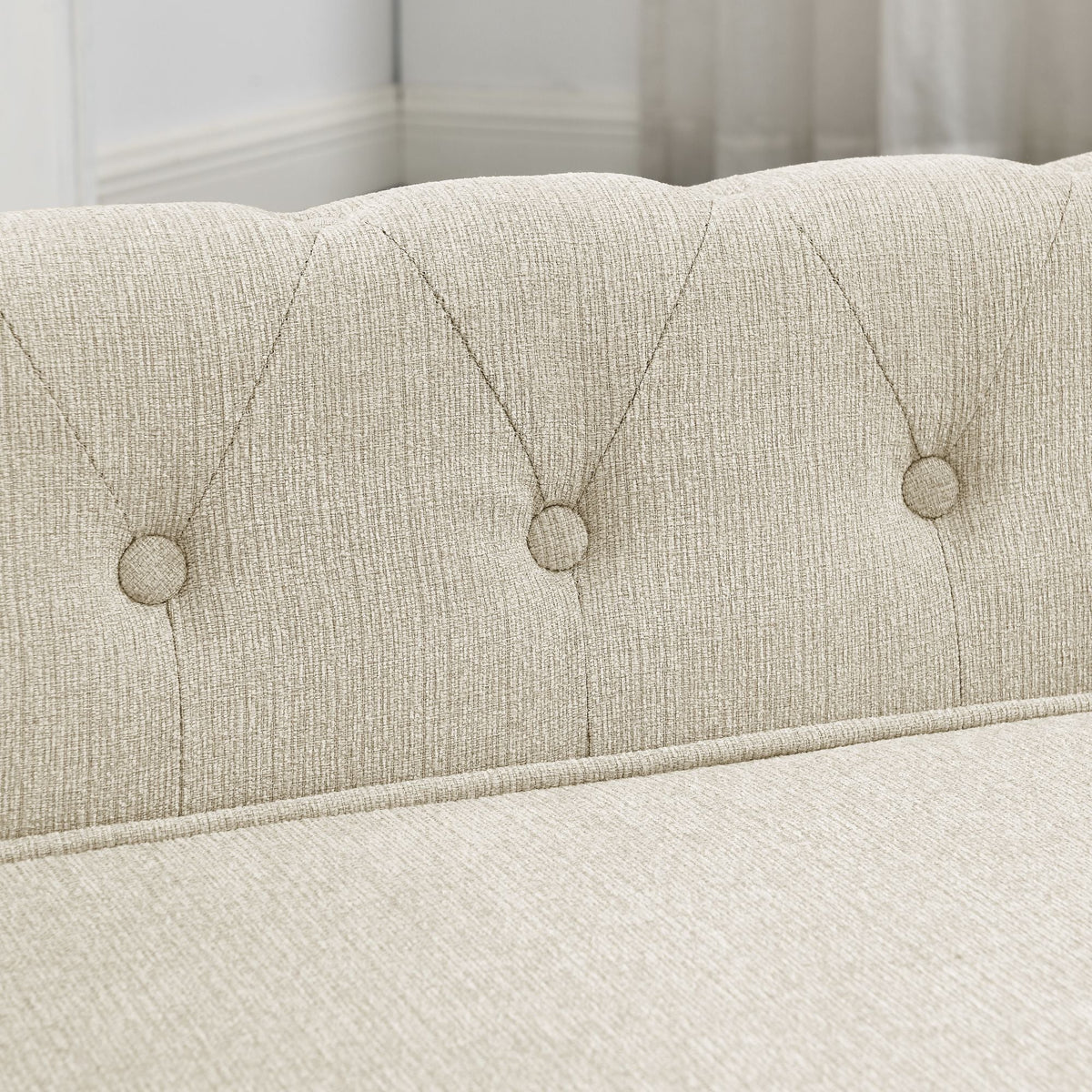 Beige dog sofa bed backrest with evenly spaced button tufting
