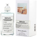 Eau de toilette spray bottle and retail box; clear glass, white label, 100 ml