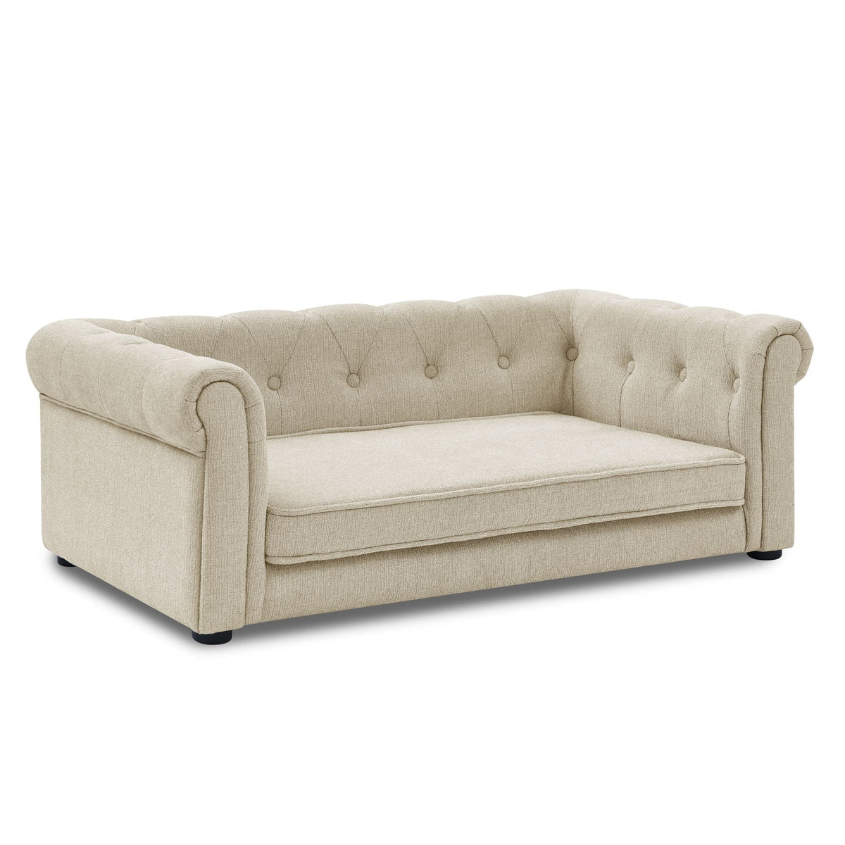 Beige dog sofa bed with rolled arms and tufted back, black feet visible