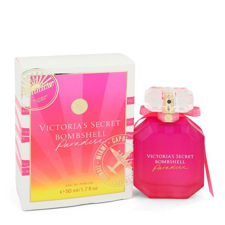 Pink eau de parfum spray bottle with ribbon, shown with matching gift box.