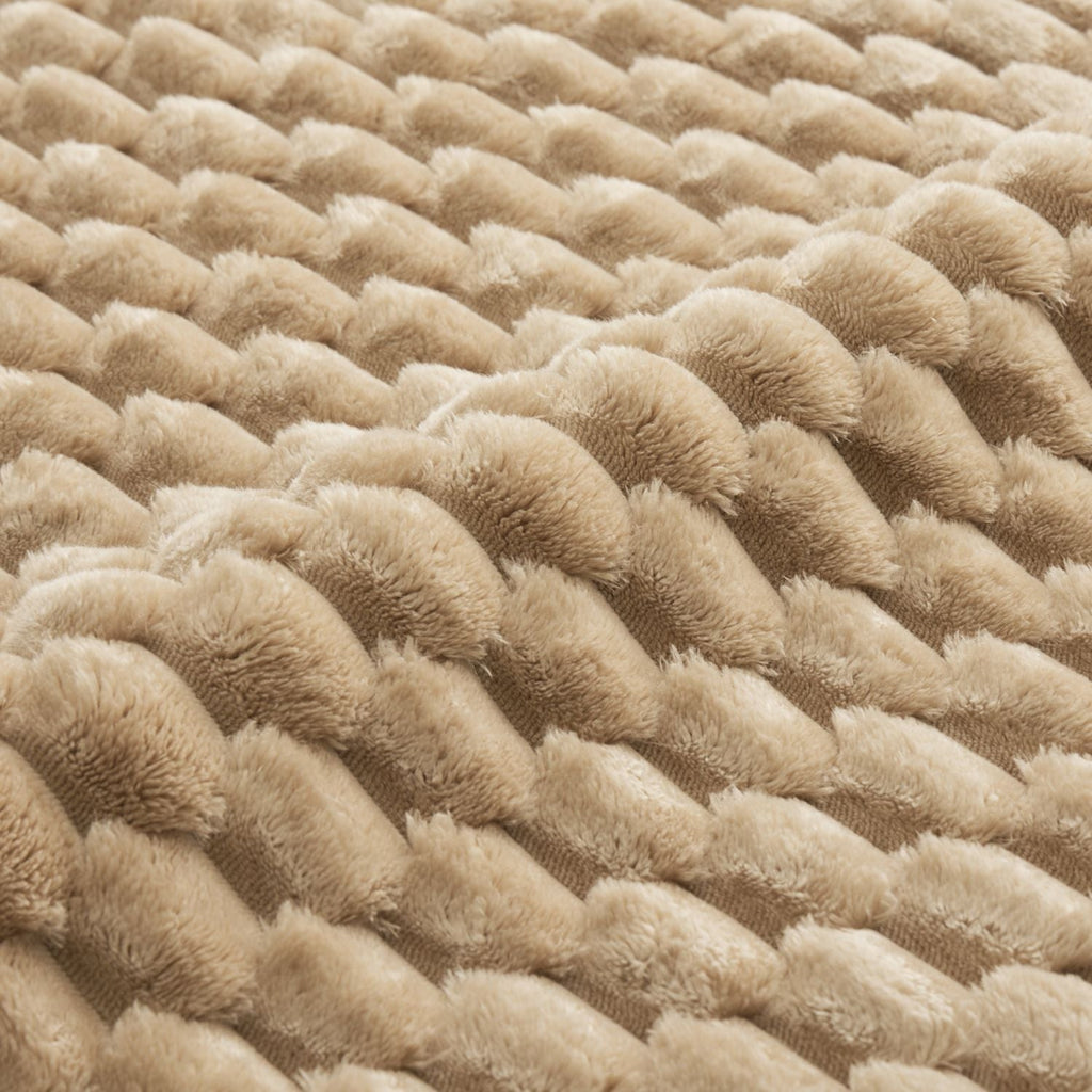 Close-up of light camel plush flannelette fabric with dense tufted loop texture