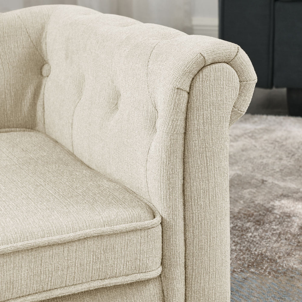 Beige dog sofa bed armrest detail with plush upholstery and rounded corner profile