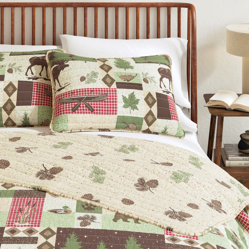 Lodge patchwork quilt and matching pillows with animal, tree, and plaid pattern