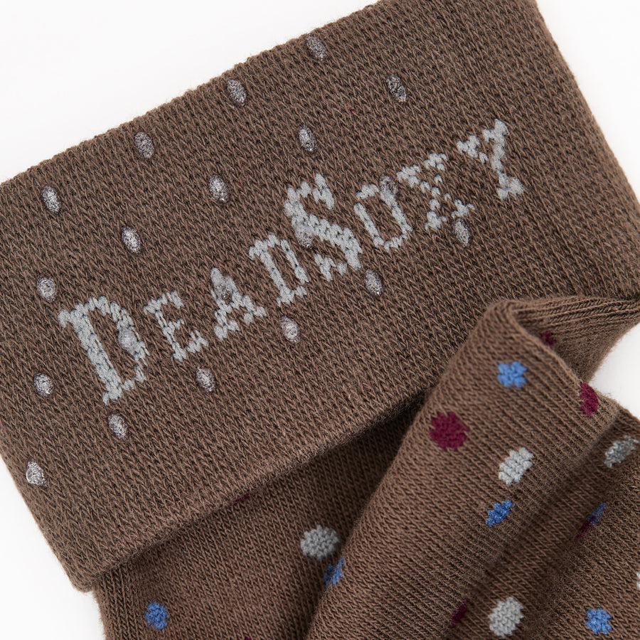 Close-up of dark brown dress socks with multicolor speckled design