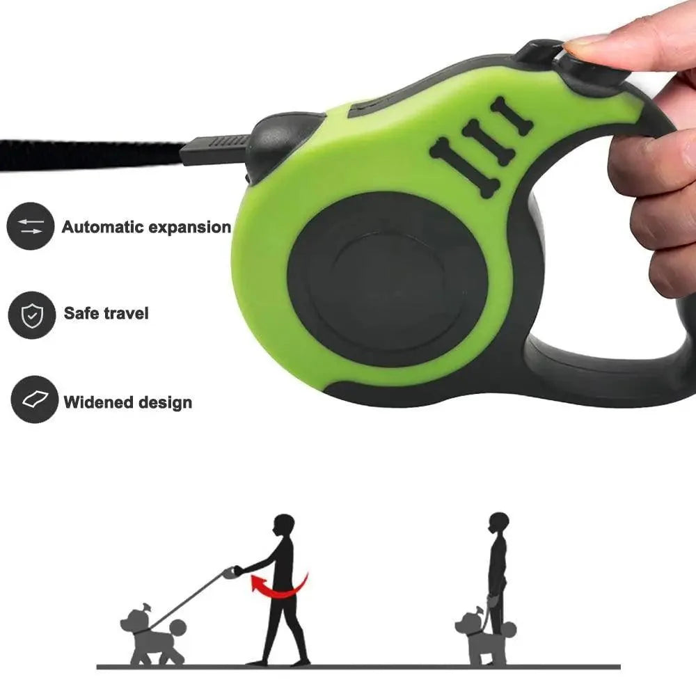 Automatic retractable dog leash with lime green housing held in hand, black grip