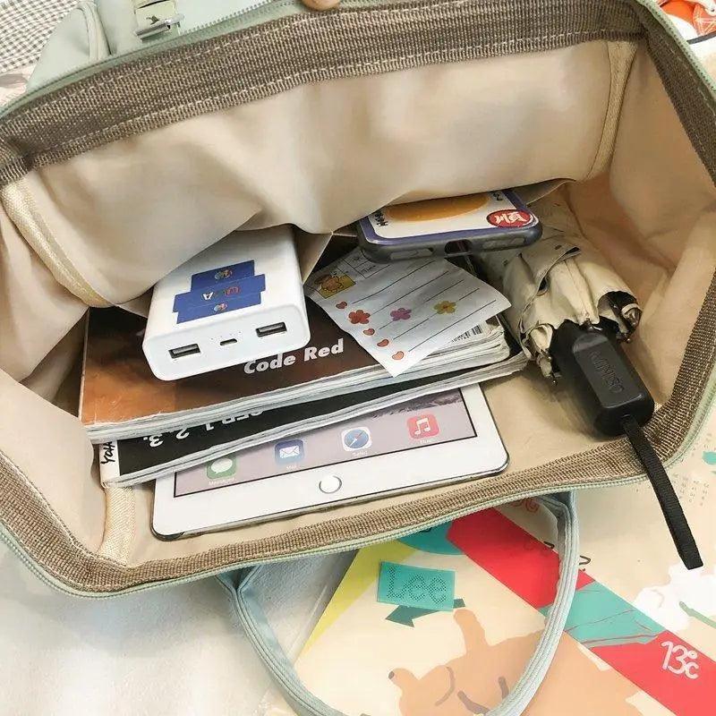 Beige backpack interior with organizer slots for cards, phone, and small items