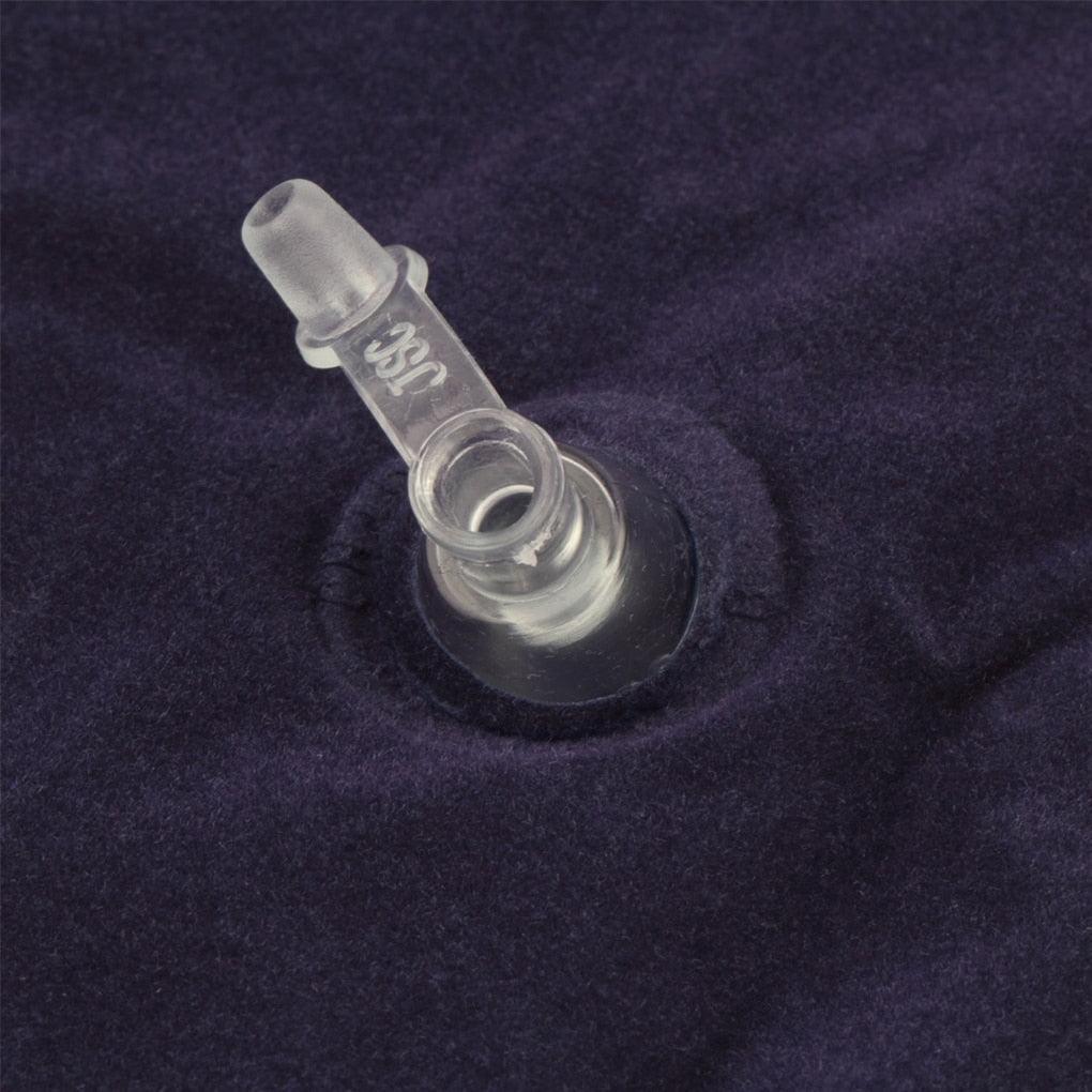 Inflatable pillow valve and air inlet on dark navy fabric