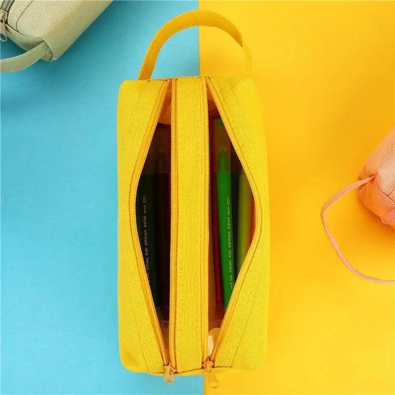 Yellow double-layer pencil case open, showing two inner compartments