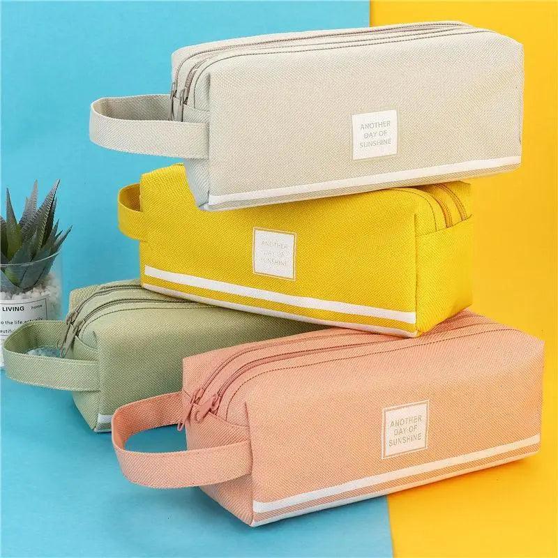 Double-layer pencil case with wrist strap, beige, yellow, and pink striped design