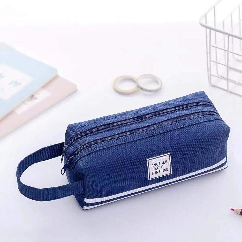 Double-layer pencil case in navy with white stripe, zipper and crossbody strap