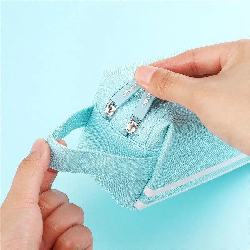 Light blue pencil case pouch with top zipper and printed label
