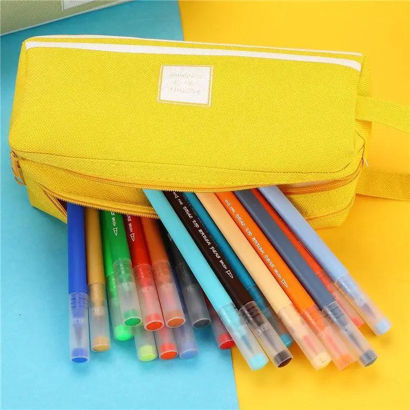 Yellow double-layer pencil case with pens visible through open top and zip closure