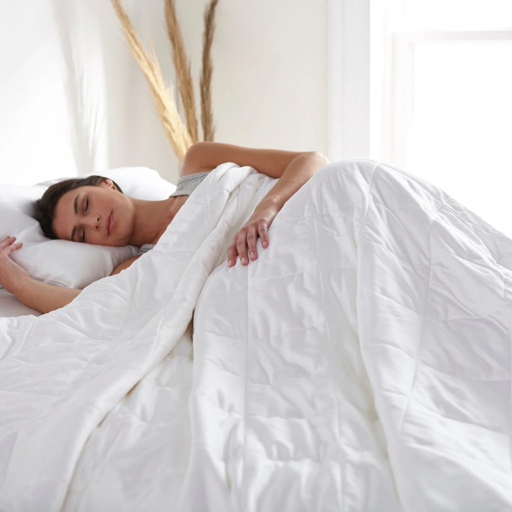 White duvet comforter over a sleeper, smooth quilted baffle panels