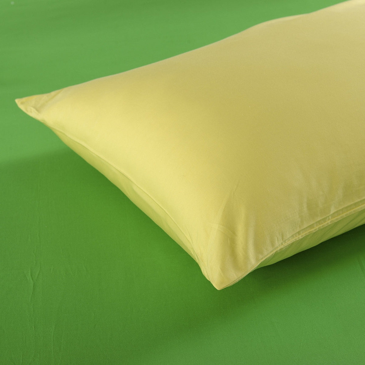 Banana yellow cotton pillow sham with smooth solid fabric and stitched edge detail
