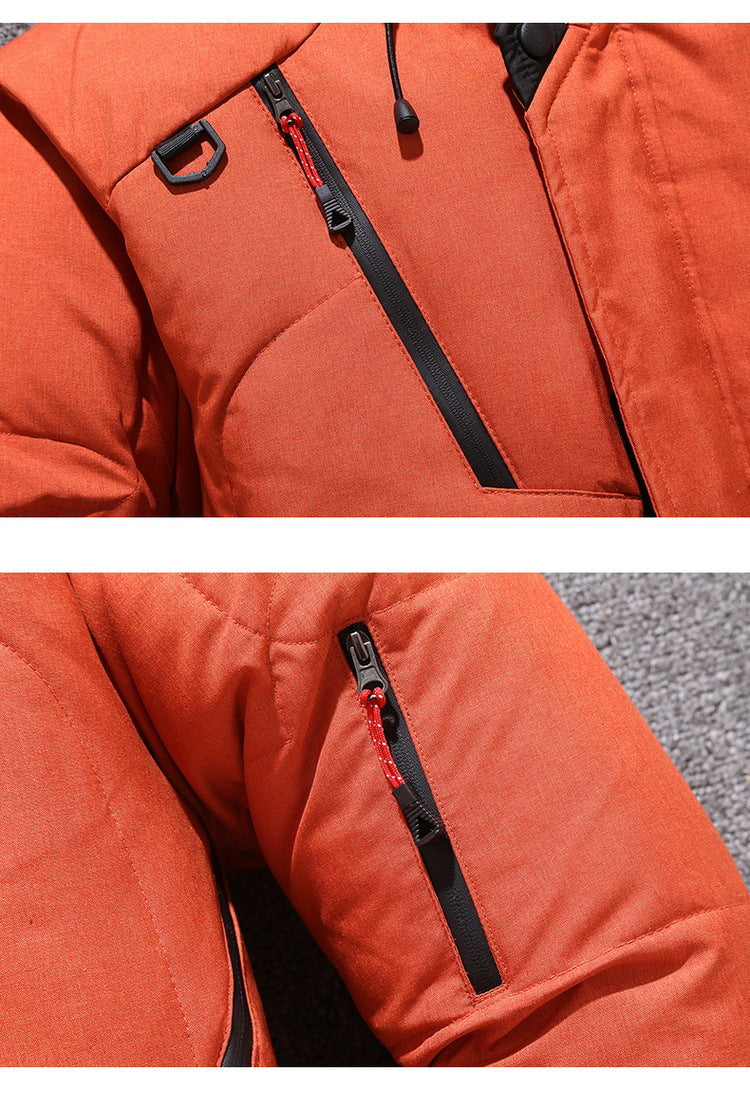 Orange hooded winter coat close-up with zipper guard and drawstring cord