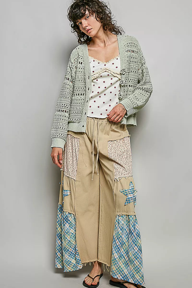 Light gray open-knit button cardigan with decorative floral trim and banded cuffs