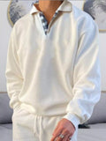 Men's white long-sleeve polo shirt with collar and quarter-button placket