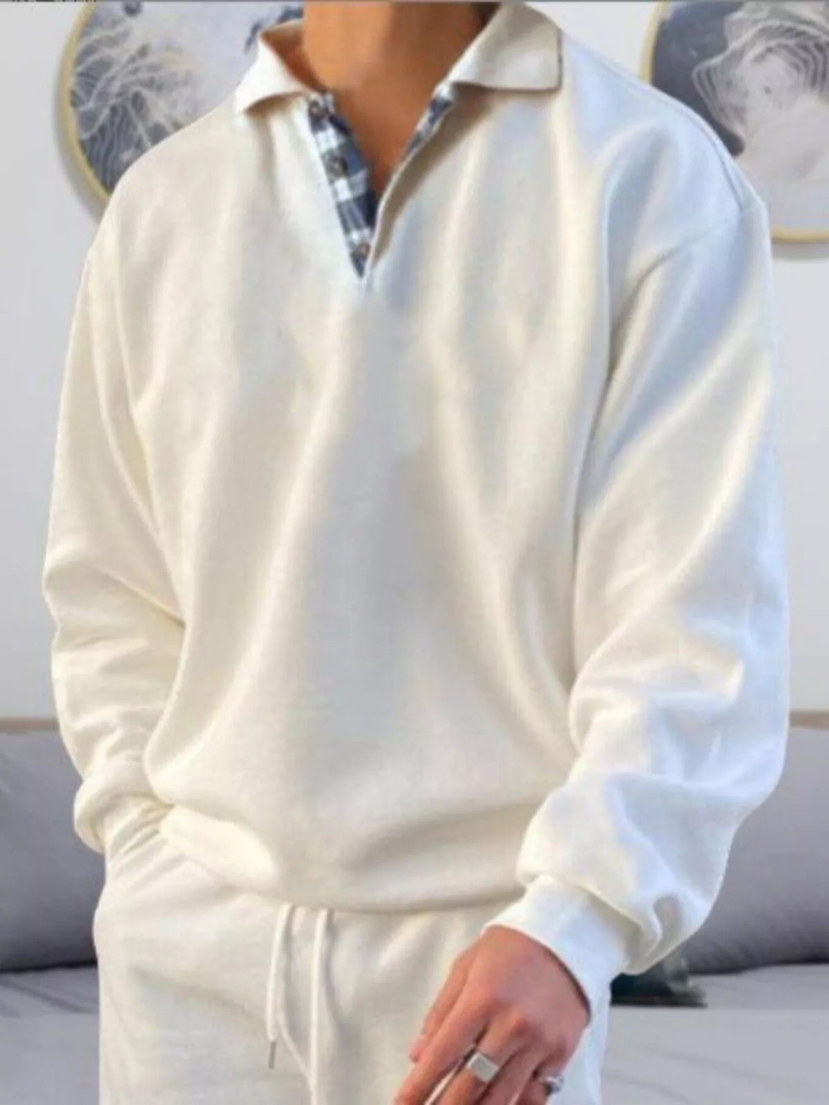 Men's white long-sleeve polo shirt with collar and quarter-button placket