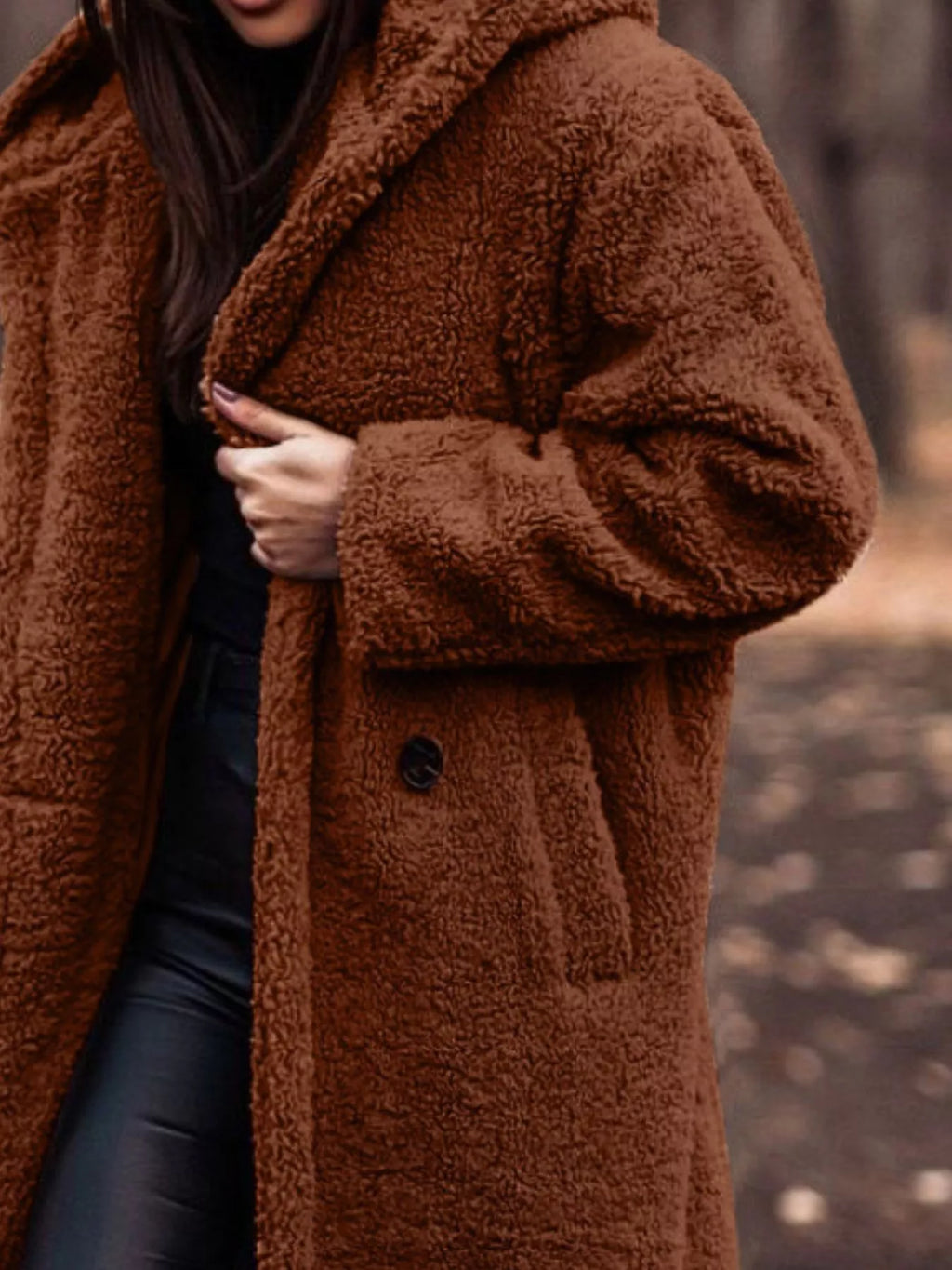 Dark brown hooded teddy longline coat with button front and fuzzy collar.